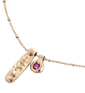 uno de 50 gold-plated metal alloy necklace, charms, and one faceted crystal.