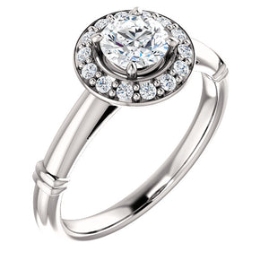 Stunning Halo Style Diamond and Platinum Engagement Ring by Moores