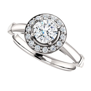 Stunning Halo Style Diamond and Platinum Engagement Ring by Moores